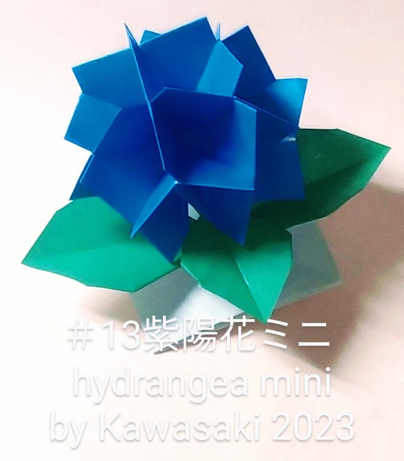 2023/02/16(Thu) 21:52「＃13紫陽花ミニ hydrangea mini(作2023,2/16,21:28)」川崎敏和 T.Kawasaki 
（創作者 Author：川崎敏和 T.Kawasaki,　製作者 Folder：川崎敏和 T.Kawasaki,　出典 Source：2023年川崎敏和折り紙キット＃13 Kawasaki origami kit）
 シルバー矩形で折ったパーツ16枚組の花を15cm1枚折りの葉っぱに乗せました。